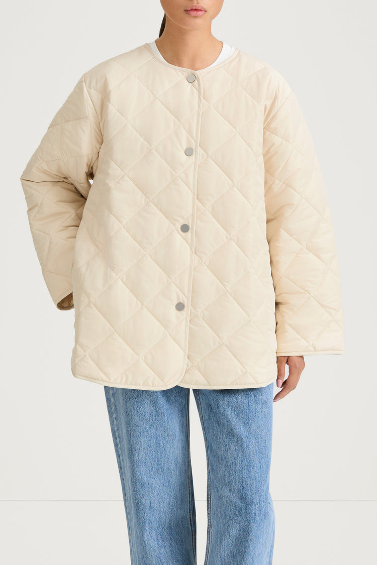 Halima loose flared quilted padded jacket ivory stylein model image front close