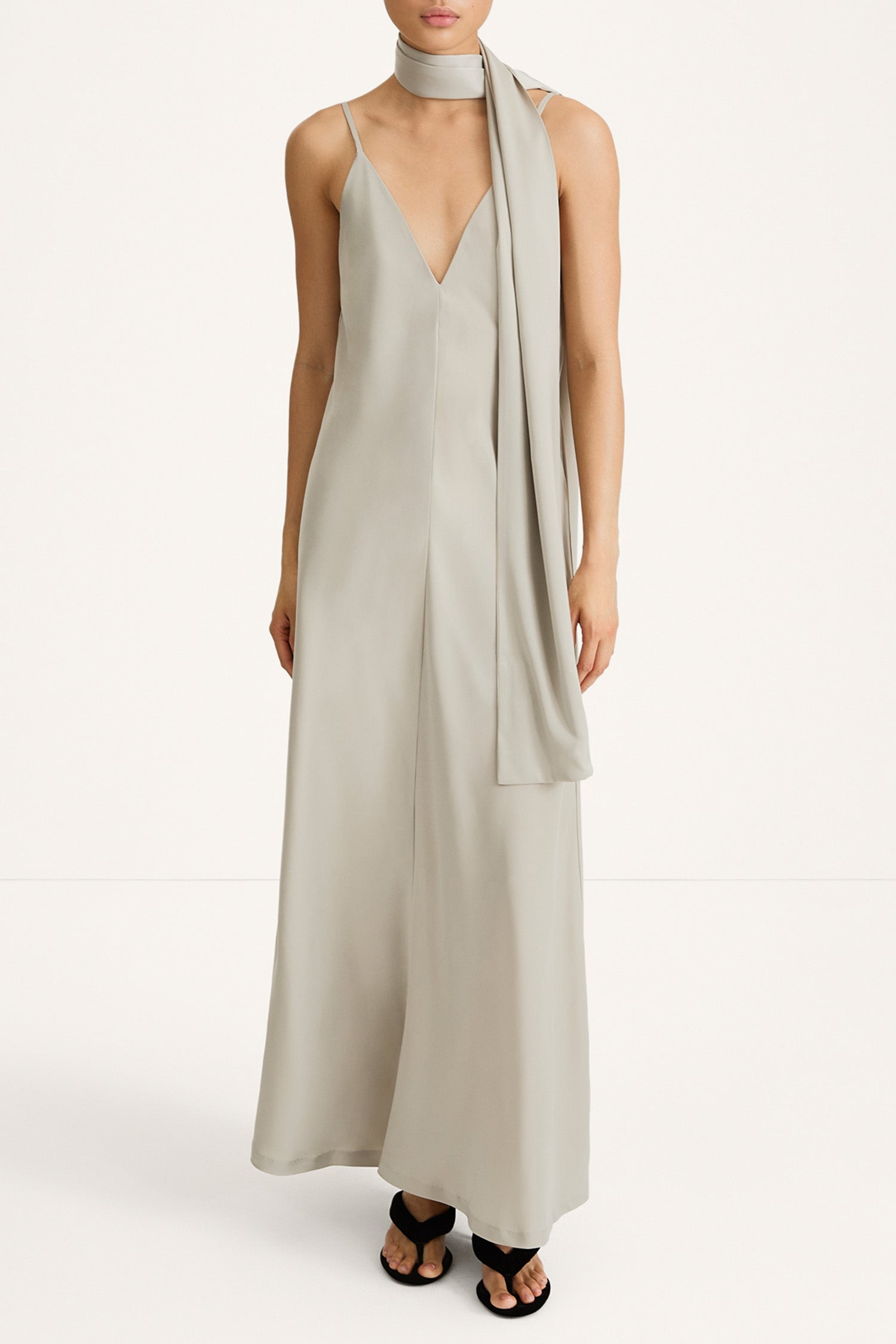 maxi slip dress in sage green with a scarf stylein macena model image