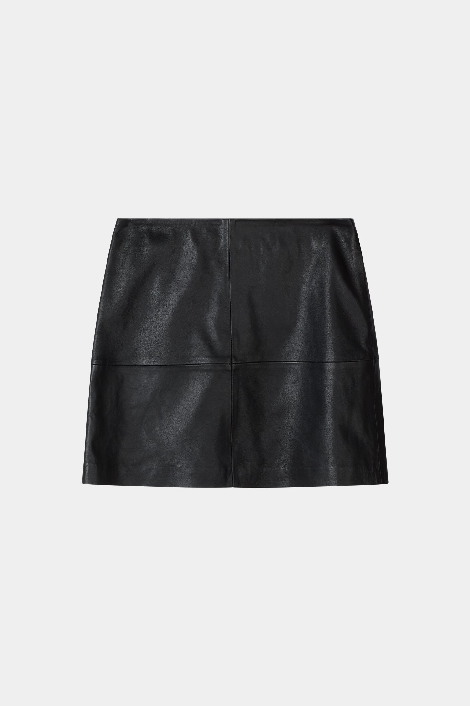 A black leather mini skirt with a structured, slightly cropped silhouette and a front seam detail, shown flat on a light gray background.