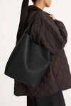 Youness bucket bag faux leather black stylein model image side close