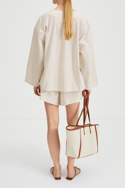 Monte blouse voluminous v neck wide sleeves seersucker beige white stripe stylein back image