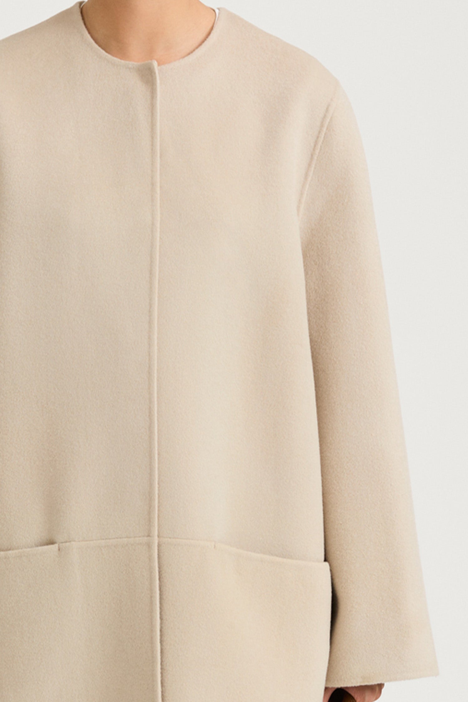 Beige wool coat stylein tara front close up model image