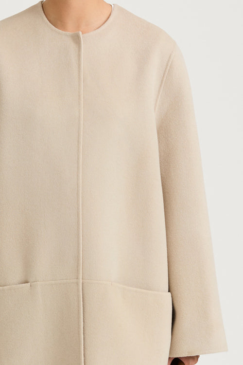 Beige wool coat stylein tara front close up model image