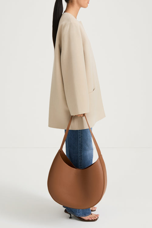 Beige wool coat stylein tara side model image