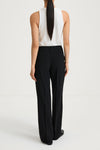 Boris is a pair of loose fitted trousers with sewn creases, pockets on the sides and loops for a belt in the waist back
