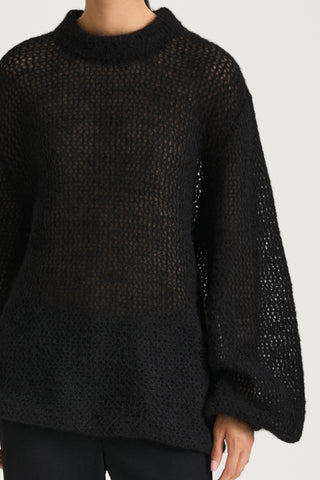 Black knitted sweater stylein nella close up front model image