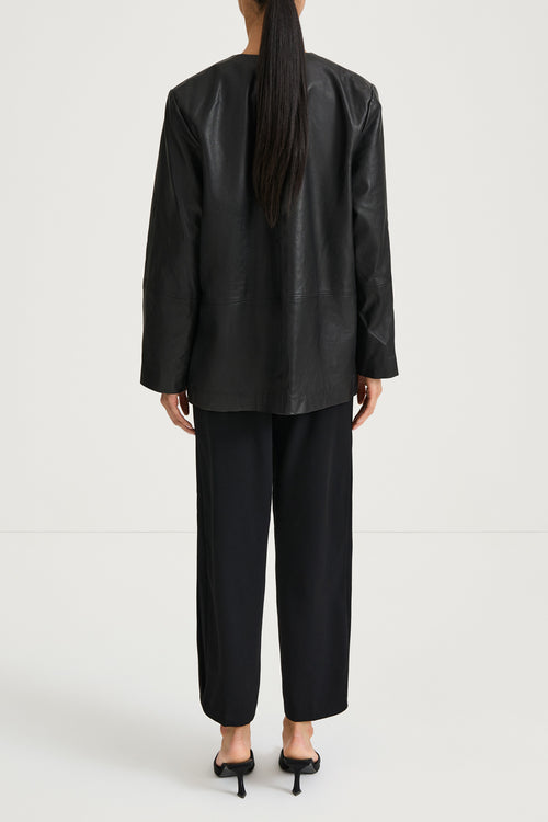 Black leather jacket stylein valencia back model image