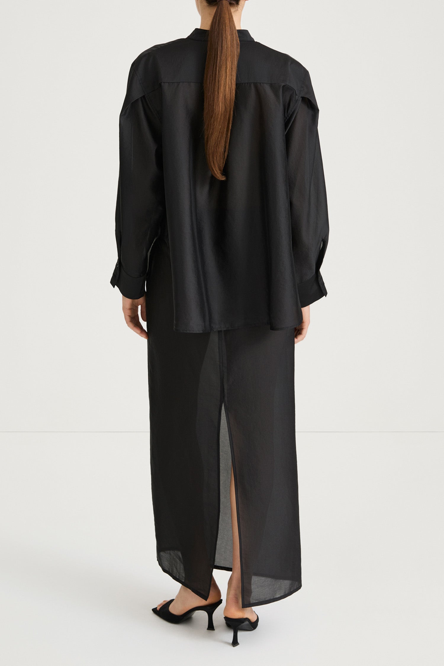 Black maxi transparent skirt stylein back model image