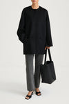 Black wool coat stylein tara front model image