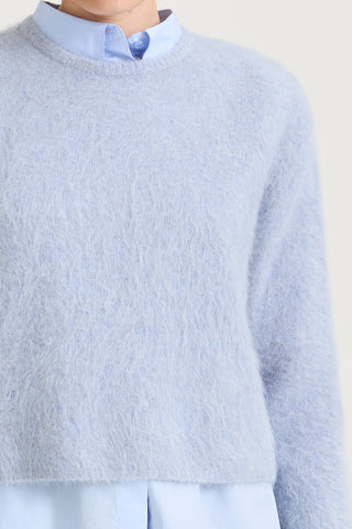 short cropped blue knitted sweater stylein detail