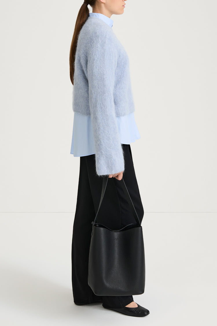 short cropped blue knitted sweater stylein side