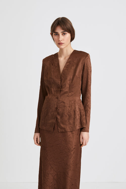 Monopoli top creased satin form fitting full length sleeves delicate shoulder pads buttons brown stylein front image