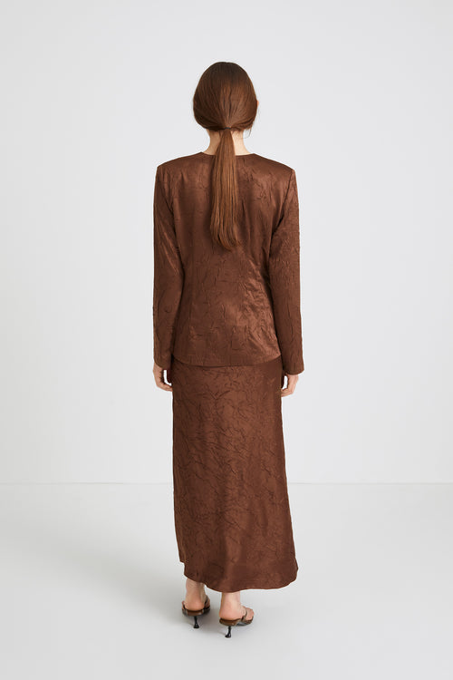 Monopoli top creased satin form fitting full length sleeves delicate shoulder pads buttons brown stylein back image