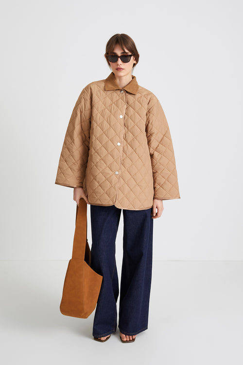 Hanna jacket voluminous quilted padding yoke and box pleats wide sleeves corduroy collar beige stylein front image
