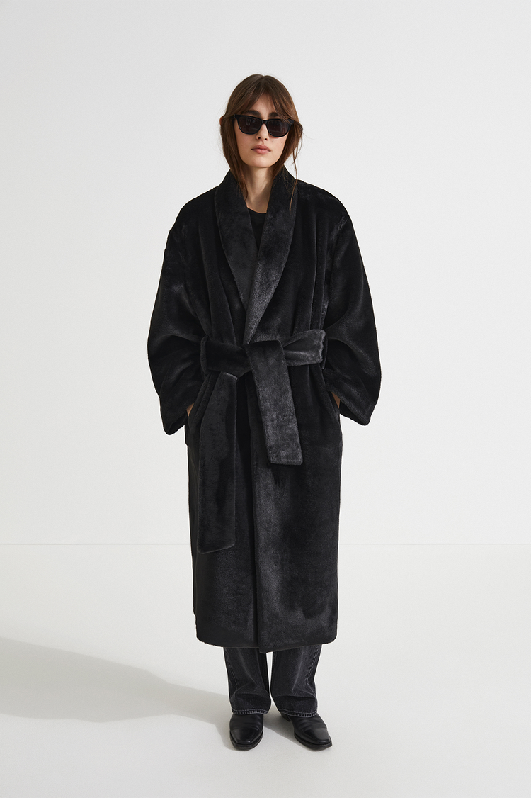 Hermina coat faux fur one piece shawl collar full length sleeves belted waits black stylein front image