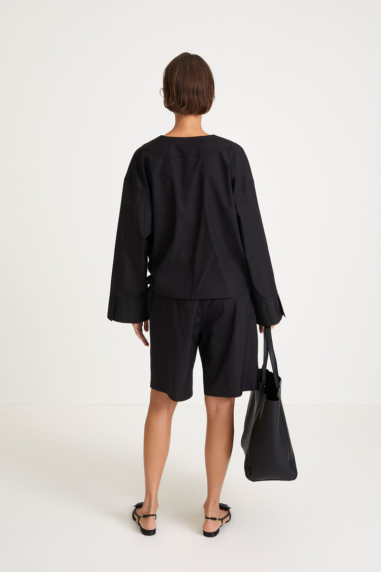 Johnny shirt voluminous v neckline overlapping front panels plates wide cuffs long sleeves black stylein packshot