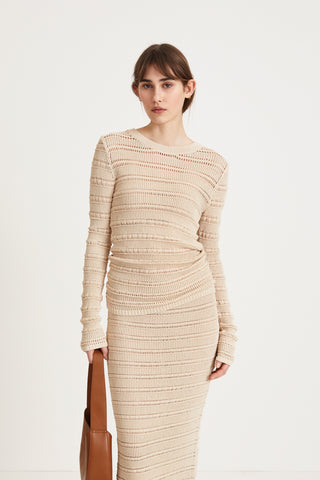 Peach top delicate knitted see-through top fitting silhouette full length sleeves cream stylein front image