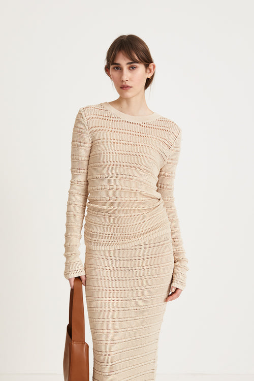 Peach top delicate knitted see-through top fitting silhouette full length sleeves cream stylein front image