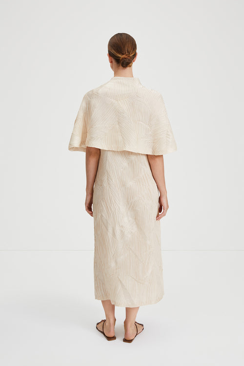 Ida cape crushed plisse fabric built up neckline darts front and back sand stylein back image