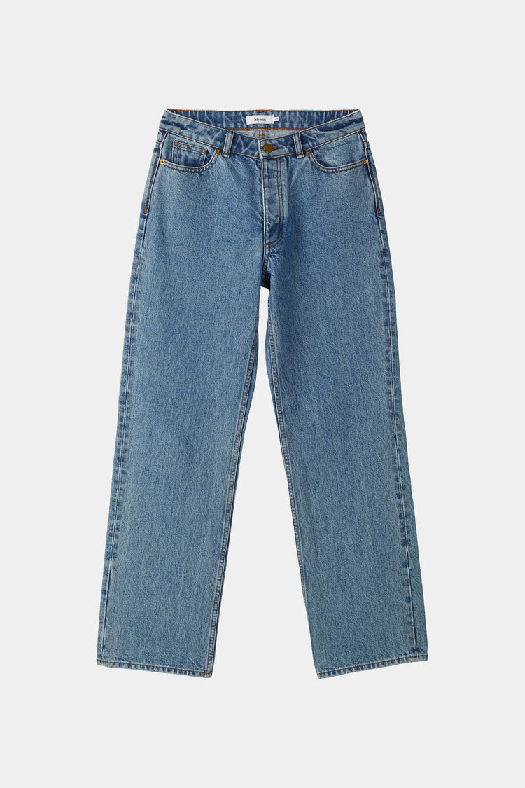 Blue jeans on a light gray background