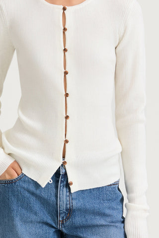 White buttoned cardigan stylein hamani front close up model image