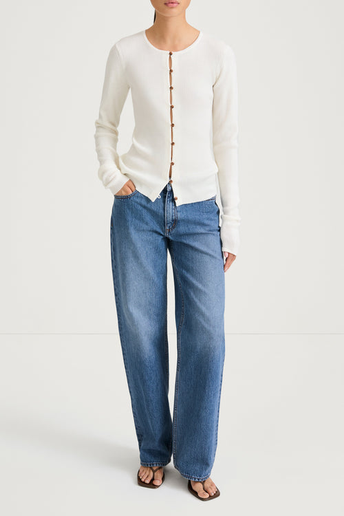 White buttoned cardigan stylein hamani front model image