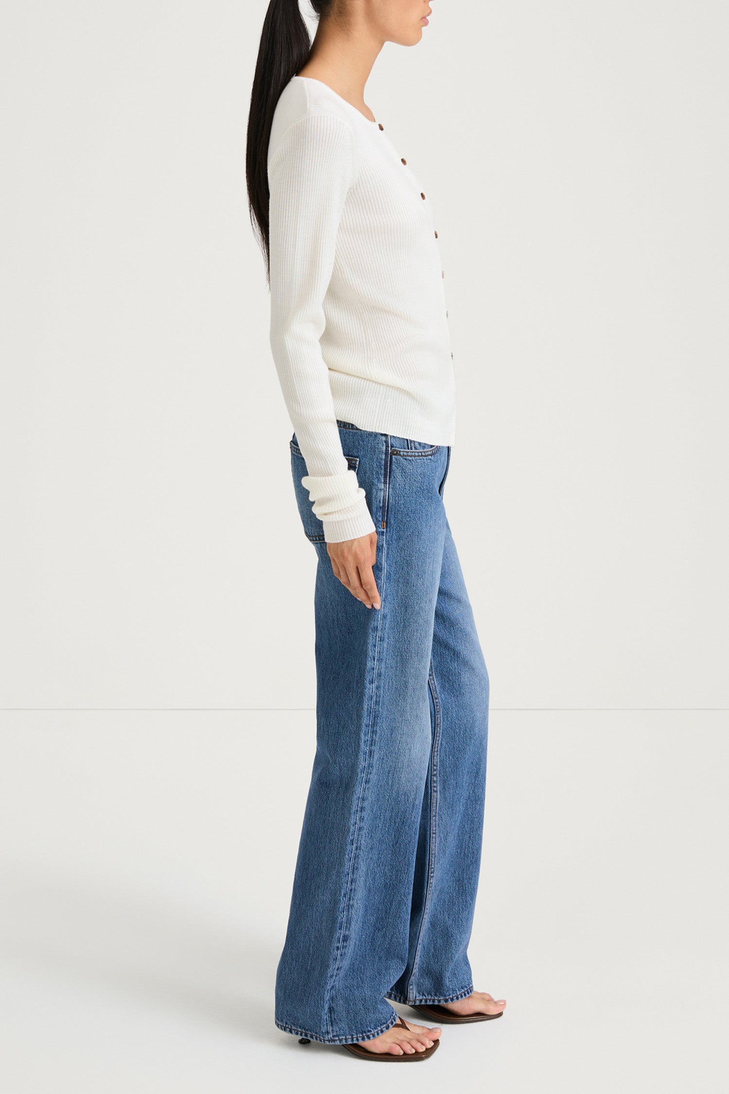 White buttoned cardigan stylein hamani side model image