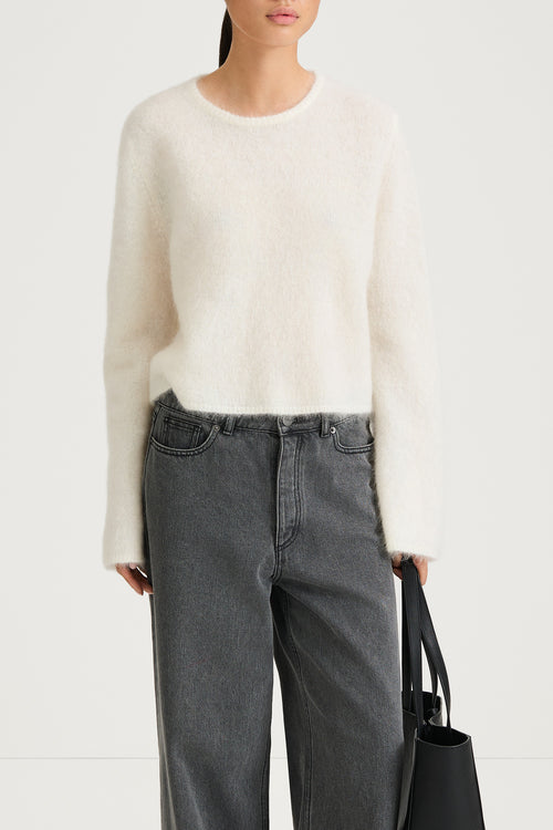 white knitted sweater stylein nima close-up