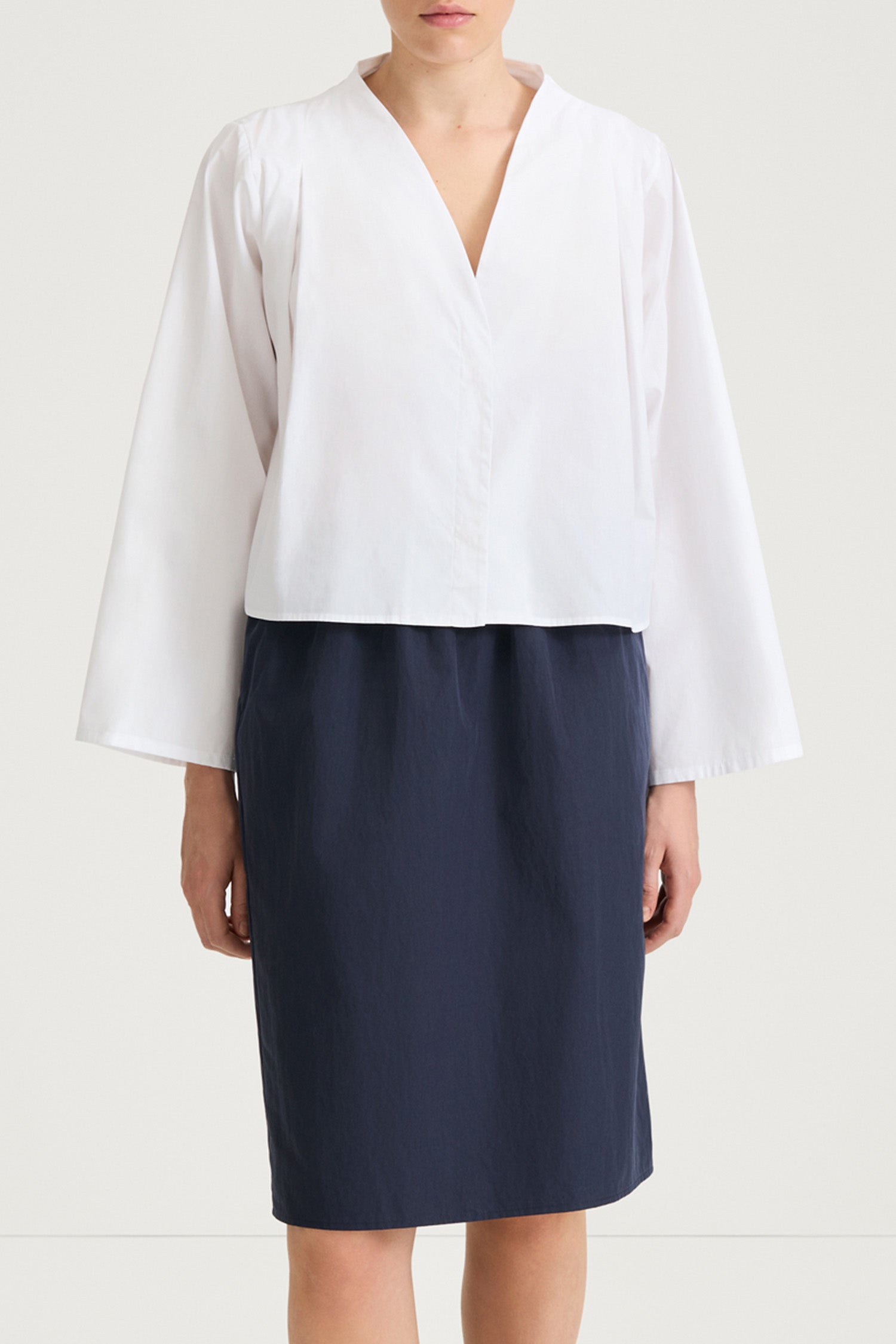 White v-neck shirt stylein jaylene front close up model image