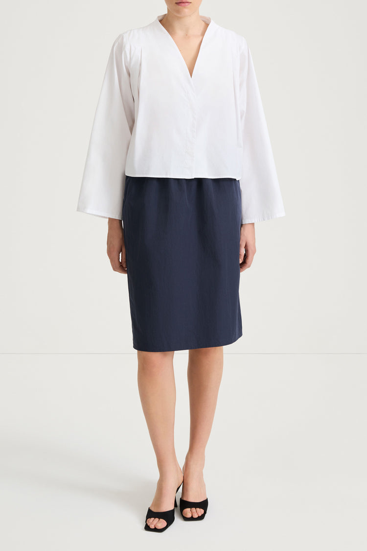 White v-neck shirt stylein jaylene front model image