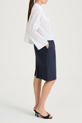 White v-neck shirt stylein jaylene side model image