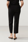 Ben is a pair of slim fitted trousers in ankle length with sewn creases and slanted side pockets.