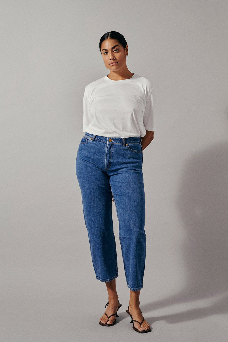 Kasey is a pair of classic straight fitted denim jeans with cropped length and mid-waist made in a more sustainable BCI cotton.