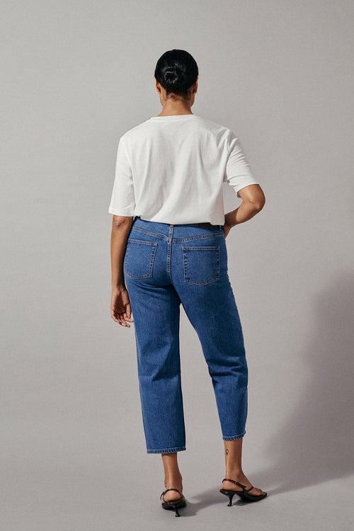 Kasey is a pair of classic straight fitted denim jeans with cropped length and mid-waist made in a more sustainable BCI cotton.