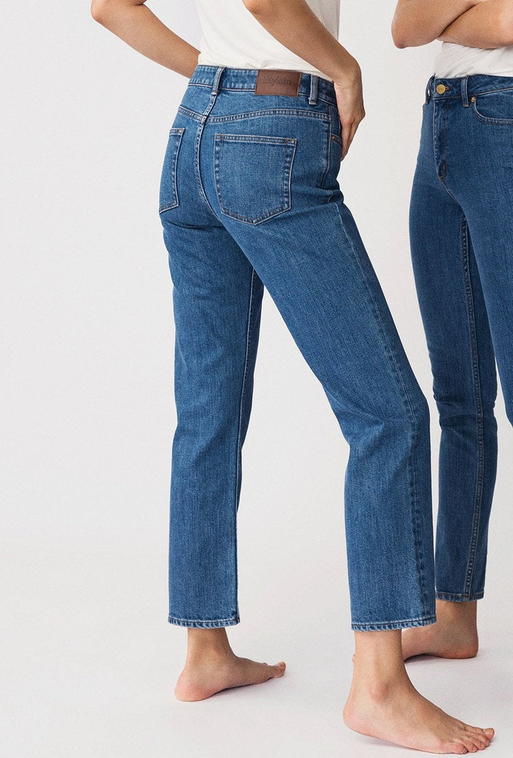 Kasey is a pair of classic straight fitted denim jeans with cropped length and mid-waist made in a more sustainable BCI cotton.