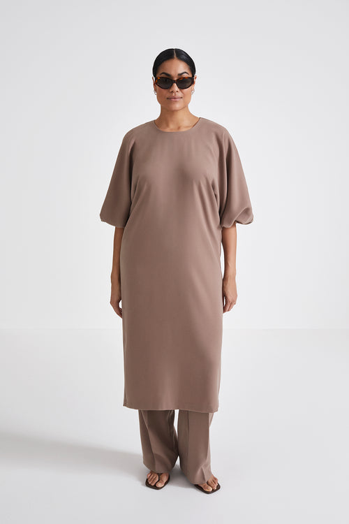 Brunate dress calf length loose fit body rounded neckline voluminous sleeves nougat stylein front image