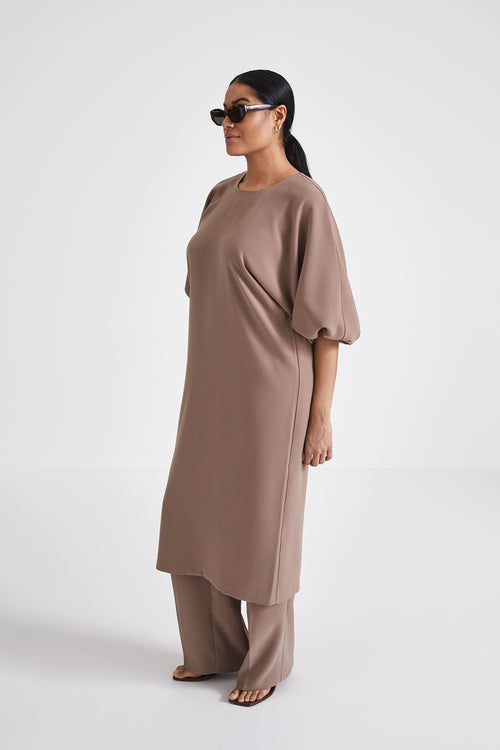 Brunate dress calf length loose fit body rounded neckline voluminous sleeves nougat stylein side image