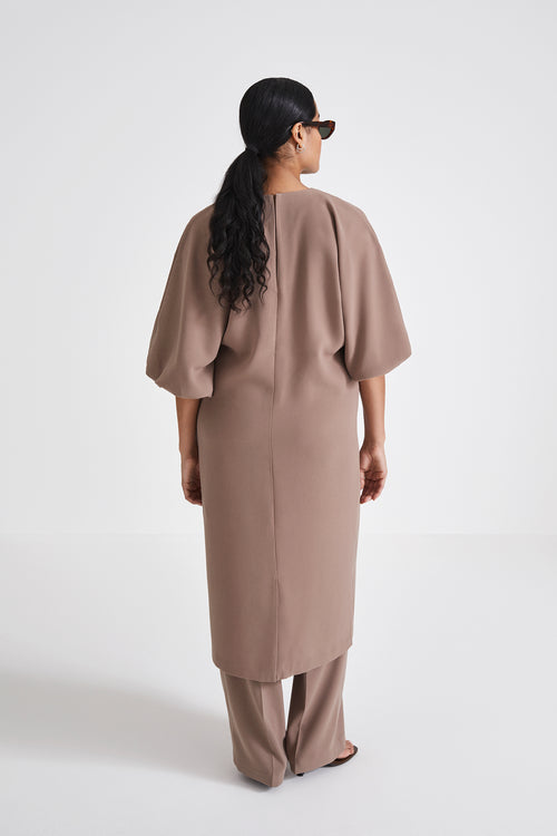 Brunate dress calf length loose fit body rounded neckline voluminous sleeves nougat stylein back image