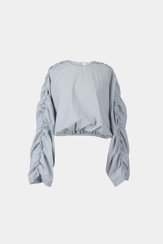 Jennifer top cotton wide long sleeves gathering detail at shoulder seems cropped elastic bottom hem rounded neckline key hole back steel blue stylein packshot