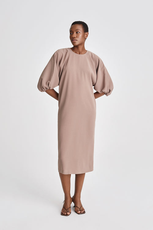 Brunate dress calf length loose fit body rounded neckline voluminous sleeves nougat stylein front image
