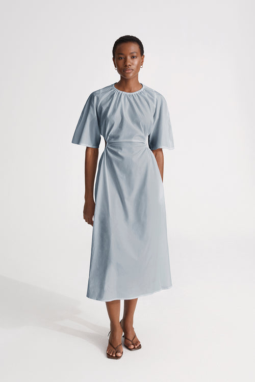 Jarama dress flared open back cotton midi gathered cuts elbow long sleeves pockets steel blue stylein front image