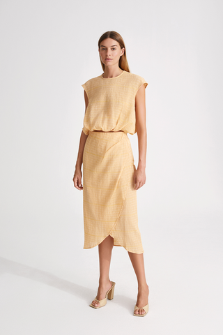 Josefine skirt calf length semi fitted higher waist high rounded front piece with slit yellow and white stylein front image