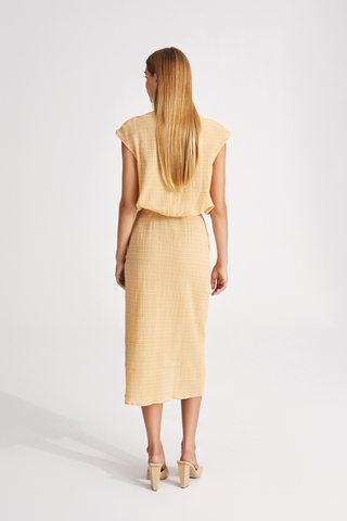 Josefine skirt calf length semi fitted higher waist high rounded front piece with slit yellow and white stylein back image