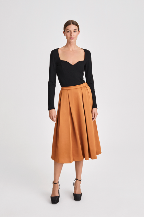 Moje skirt calf length box pleats a line dark ginger burnt orange stylein front image 